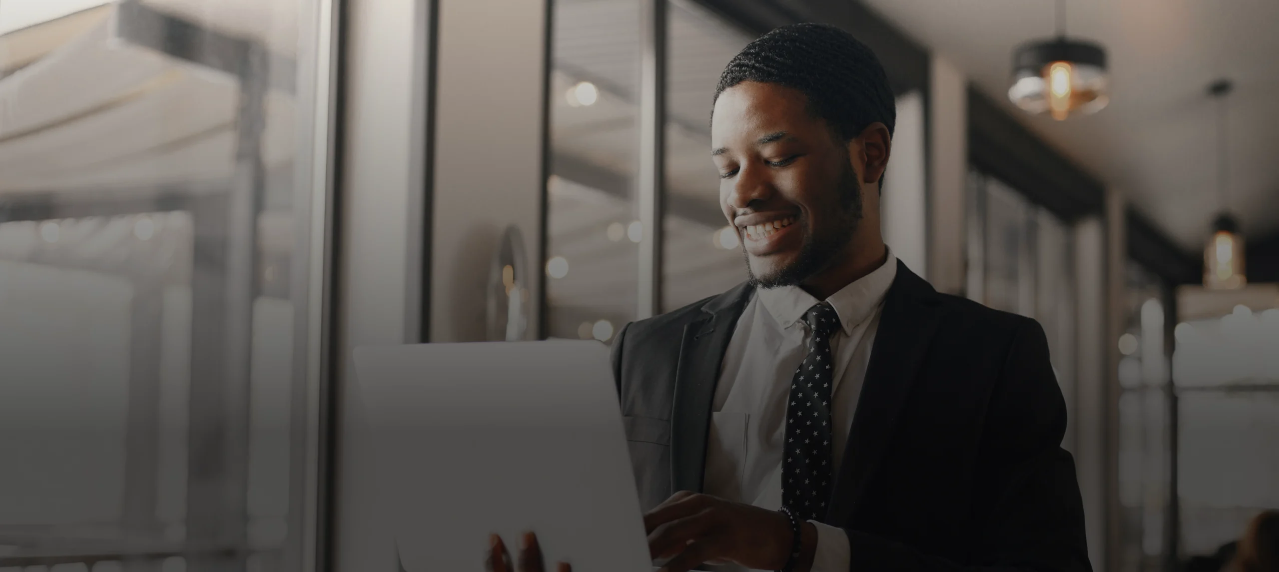 african-american-businessman-using-laptop-cafe 1